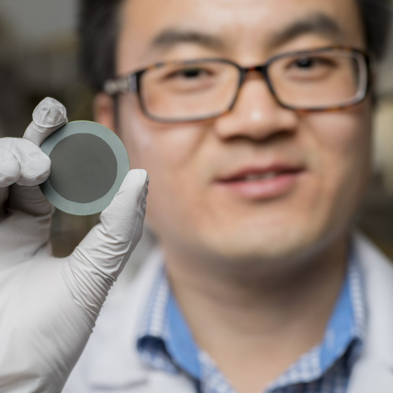 Man holding round device