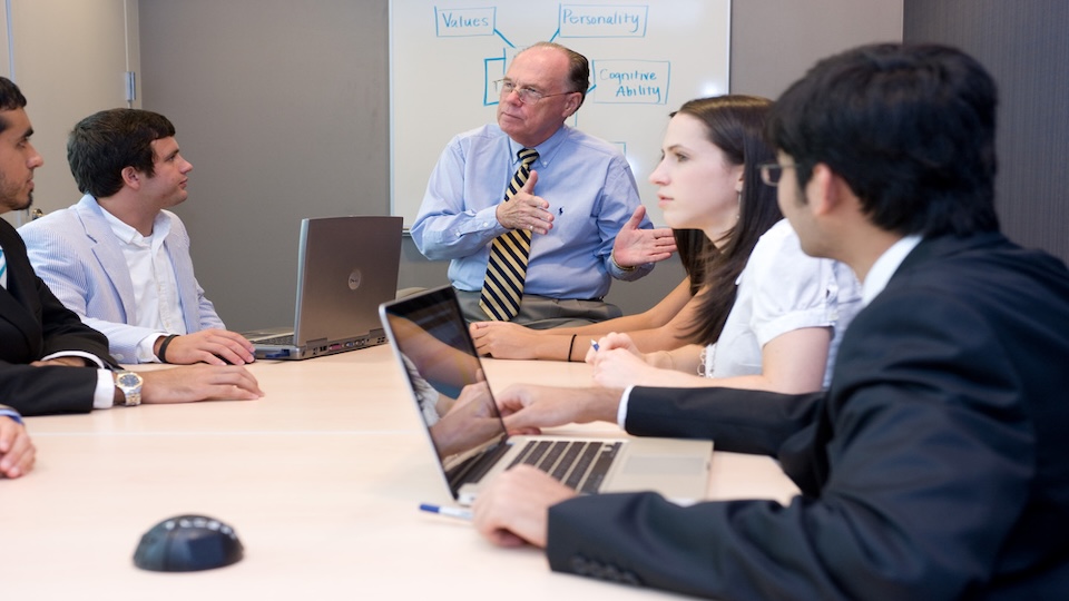 People working in a conference room. 