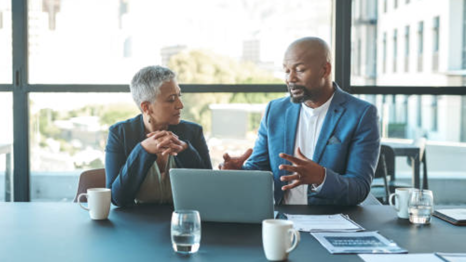 People meeting at a conference table. 