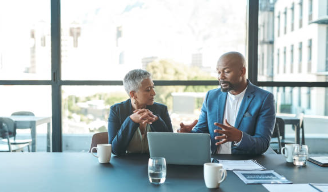People meeting at a conference table. 