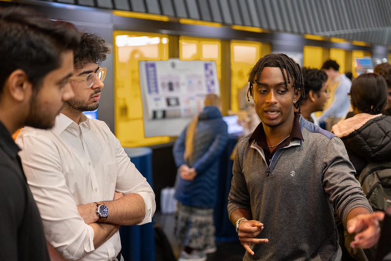 Students presenting at research event