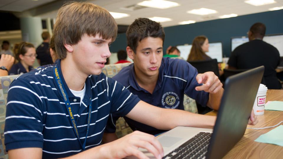 students looking at a computer 